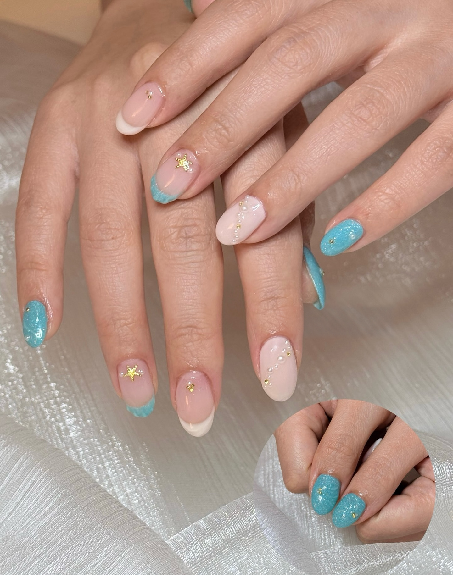 O3O Studio manicure with turquoise shimmer, pale pink French tips and gold details